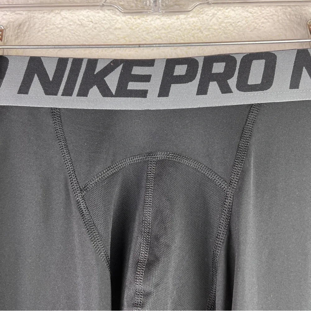 NIKE PRO TRAINING TIGHTS. Size XL. Black w/gray elastic band waistband. No snags